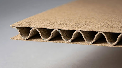 Corrugated fiberboard showing fluted medium between linerboards
