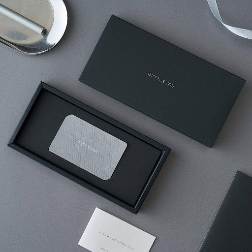 Credit card packaging boxes and printed card sleeves compared side by side