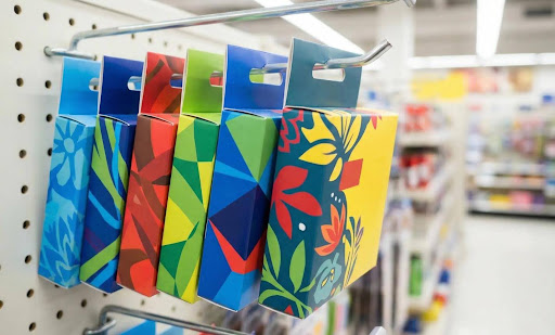 Hang tab packaging compared with standard retail boxes for store display

