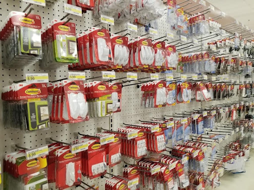 Hanging and shelf-stacked retail products displayed in a store merchandising area