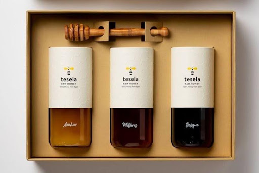 Custom honey labels paired with coordinated cardboard gift packaging - Bluebird Packaging
