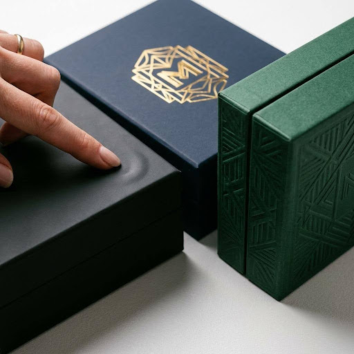 Custom retail boxes with foil stamping, matte finish, and embossed branding 